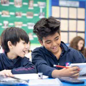 Two pupils at Knightsbridge School, a private school in London, working together in class